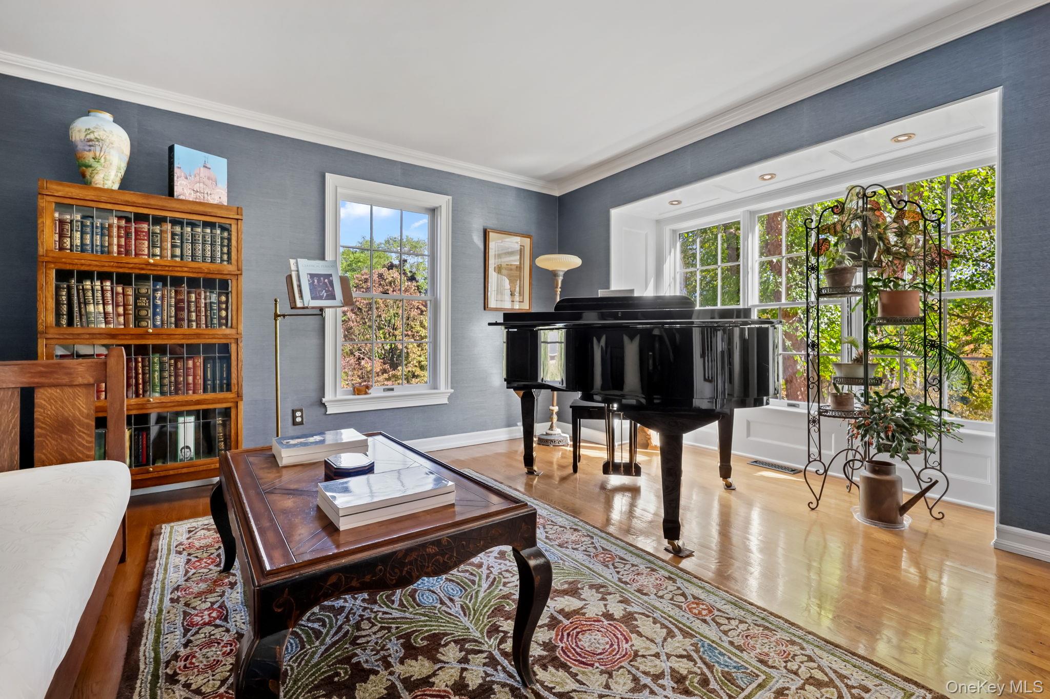 21 Adams Farm Road Katonah, NY 10536 - Photo 7 of 47 a living room with furniture a bookshelf and a large window