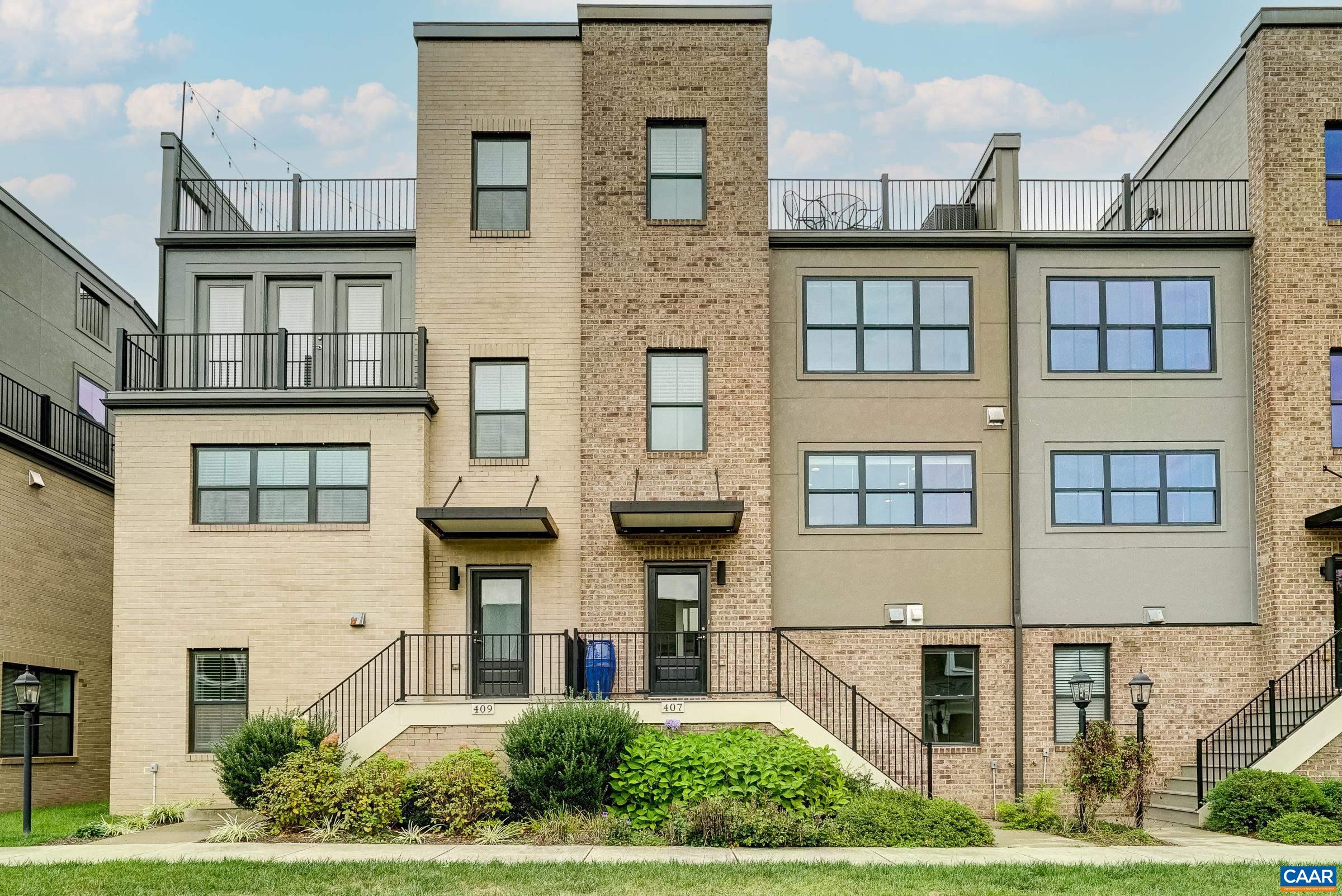 407 Fennel Road Crozet, VA 22932 - Photo 1 of 55 Beautiful modern townhome in the heart of Old Trail is walkable to shops and restaurants with common green space in front of the home.