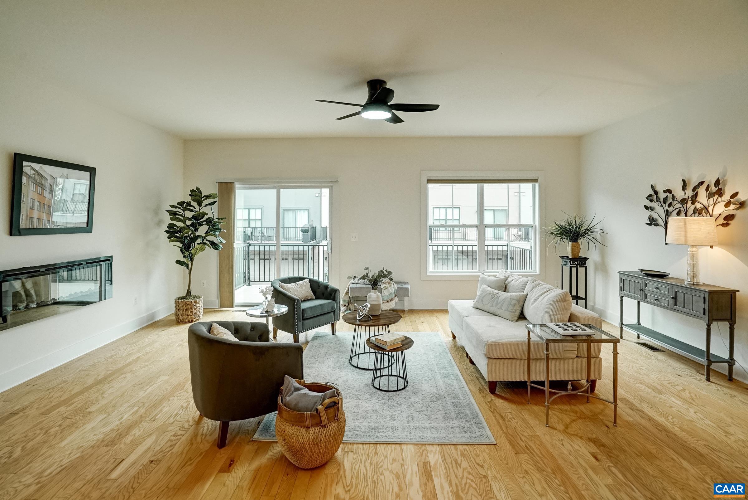 407 Fennel Road Crozet, VA 22932 - Photo 16 of 55 Living room features a ceiling fan and electric fireplace.