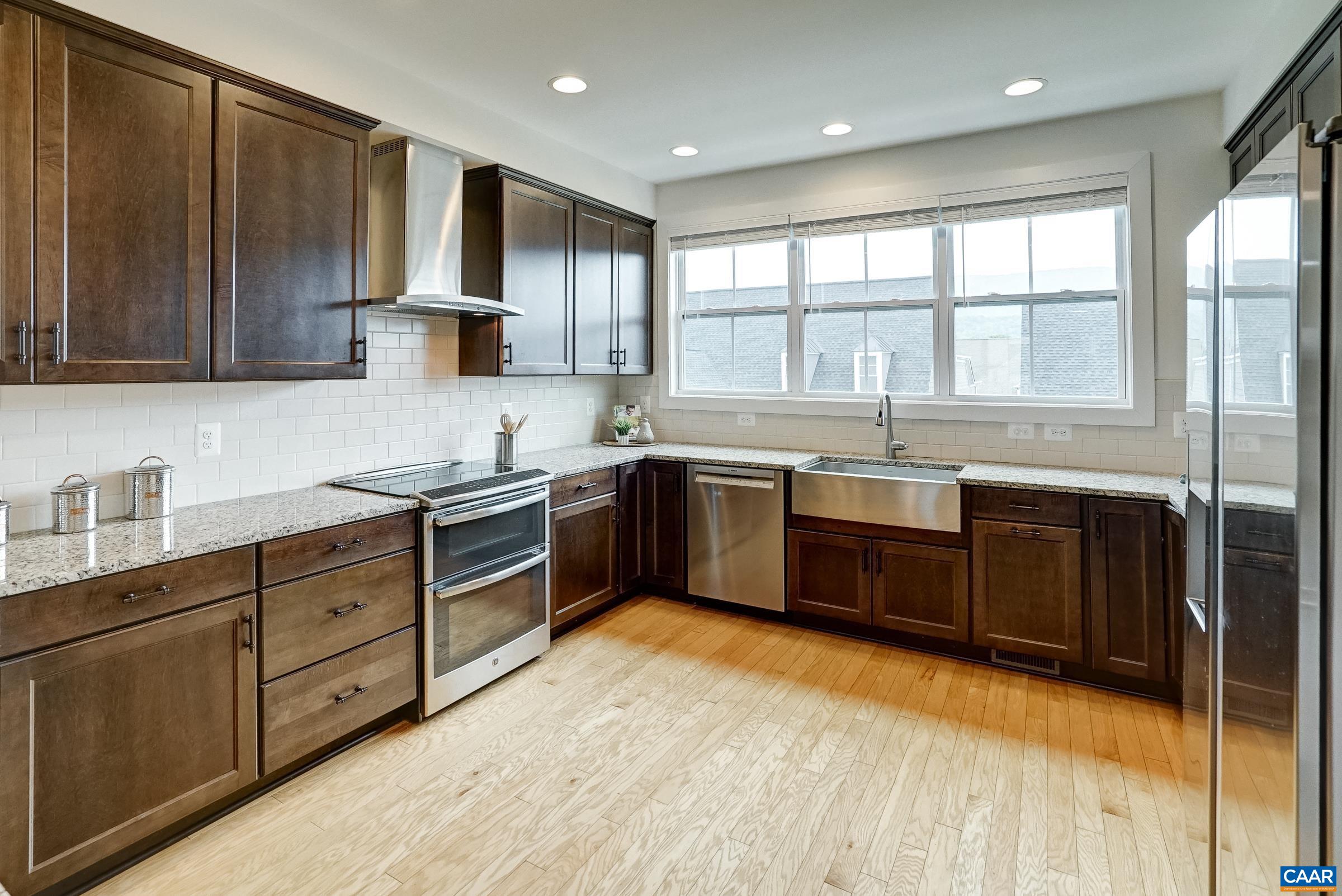 407 Fennel Road Crozet, VA 22932 - Photo 6 of 55 Modern kitchen features espresso stained cabinets, and granite countertops.