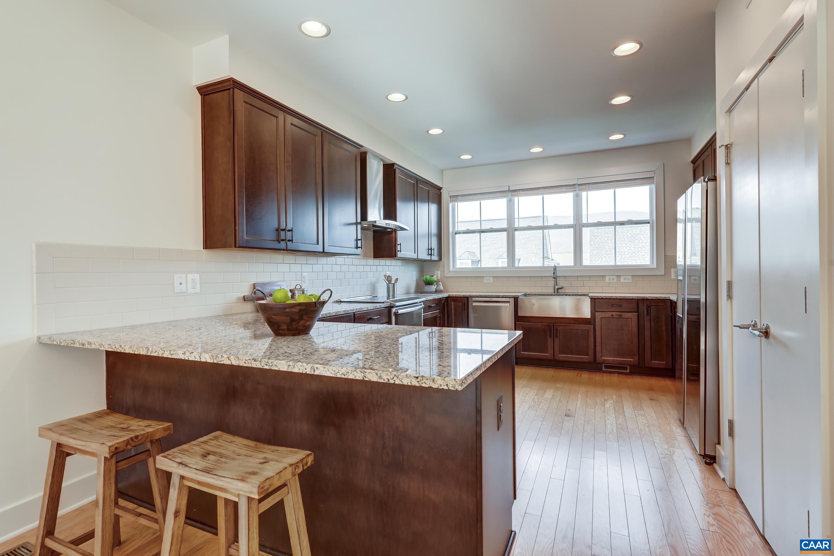 407 Fennel Road Crozet, VA 22932 - Photo 6 of 54 Modern kitchen features espresso stained cabinets, and granite countertops.