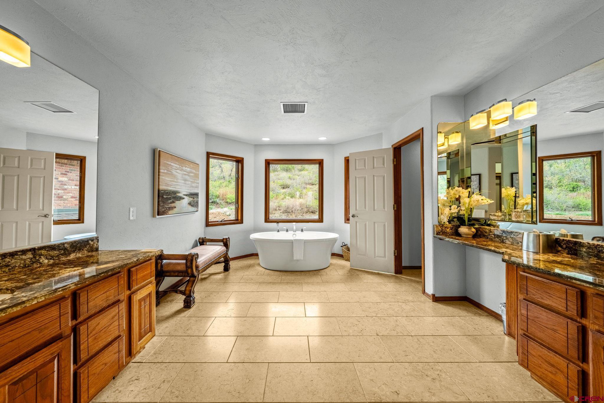 201 Ute Canyon Road Durango, CO 81301 - Photo 16 of 44 a large open kitchen with stainless steel appliances granite countertop a stove a sink and a refrigerator