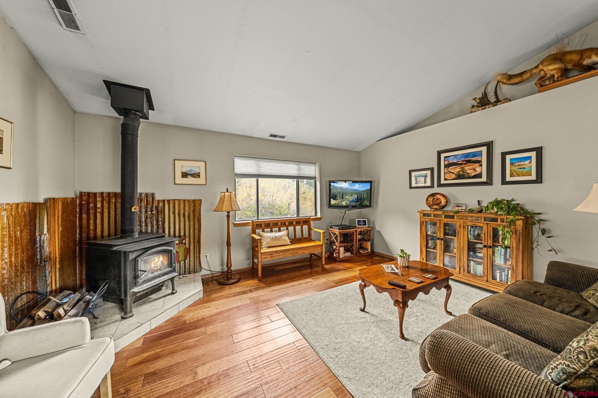 201 Ute Canyon Road Durango, CO 81301 - Photo 24 of 44 a living room with furniture and a flat screen tv
