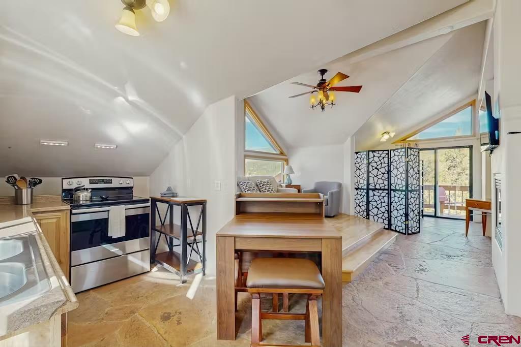 201 Ute Canyon Road Durango, CO 81301 - Photo 27 of 44 a living room with stainless steel appliances kitchen island granite countertop furniture and a kitchen view