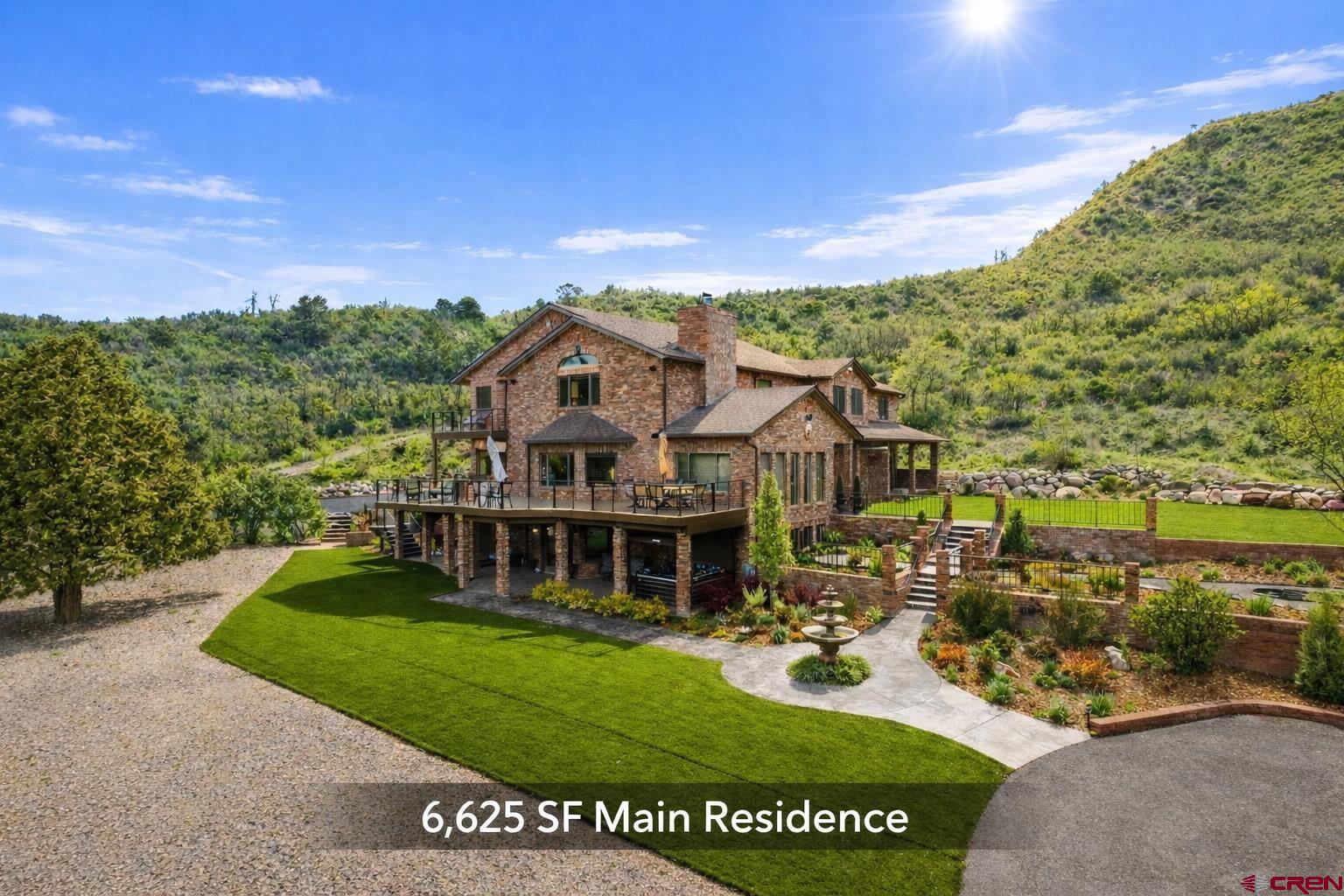 201 Ute Canyon Road Durango, CO 81301 - Photo 3 of 44 a view of a house with a big yard