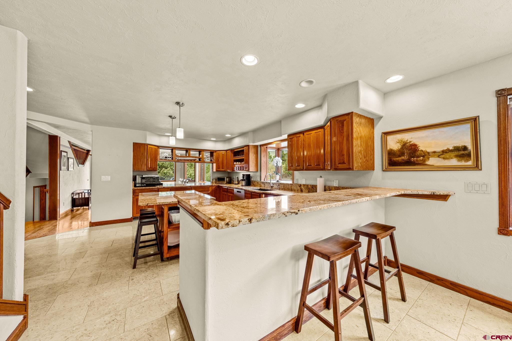 201 Ute Canyon Road Durango, CO 81301 - Photo 33 of 44 a view of a kitchen and dining room