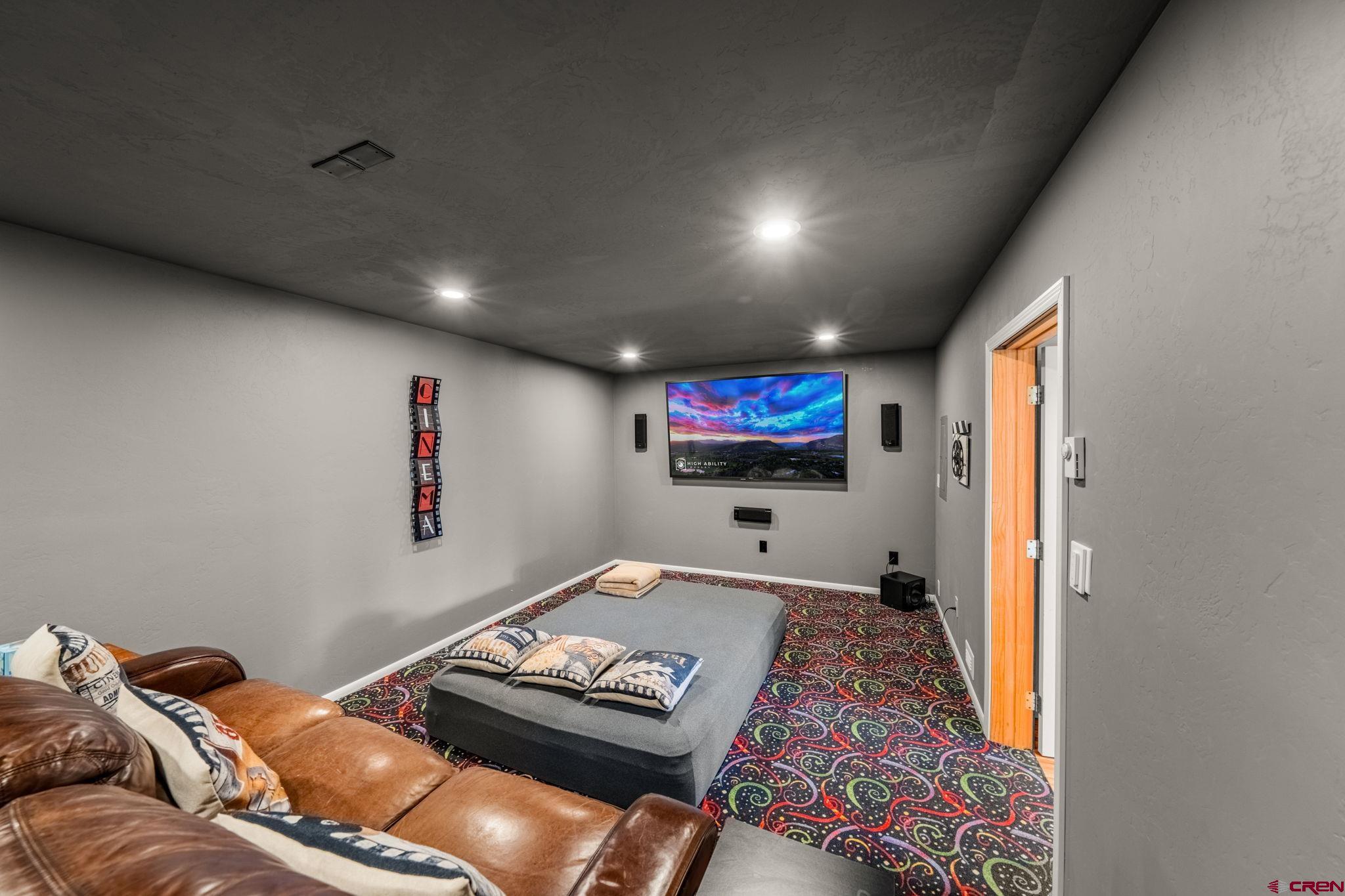 201 Ute Canyon Road Durango, CO 81301 - Photo 36 of 44 a living room with furniture and a flat screen tv