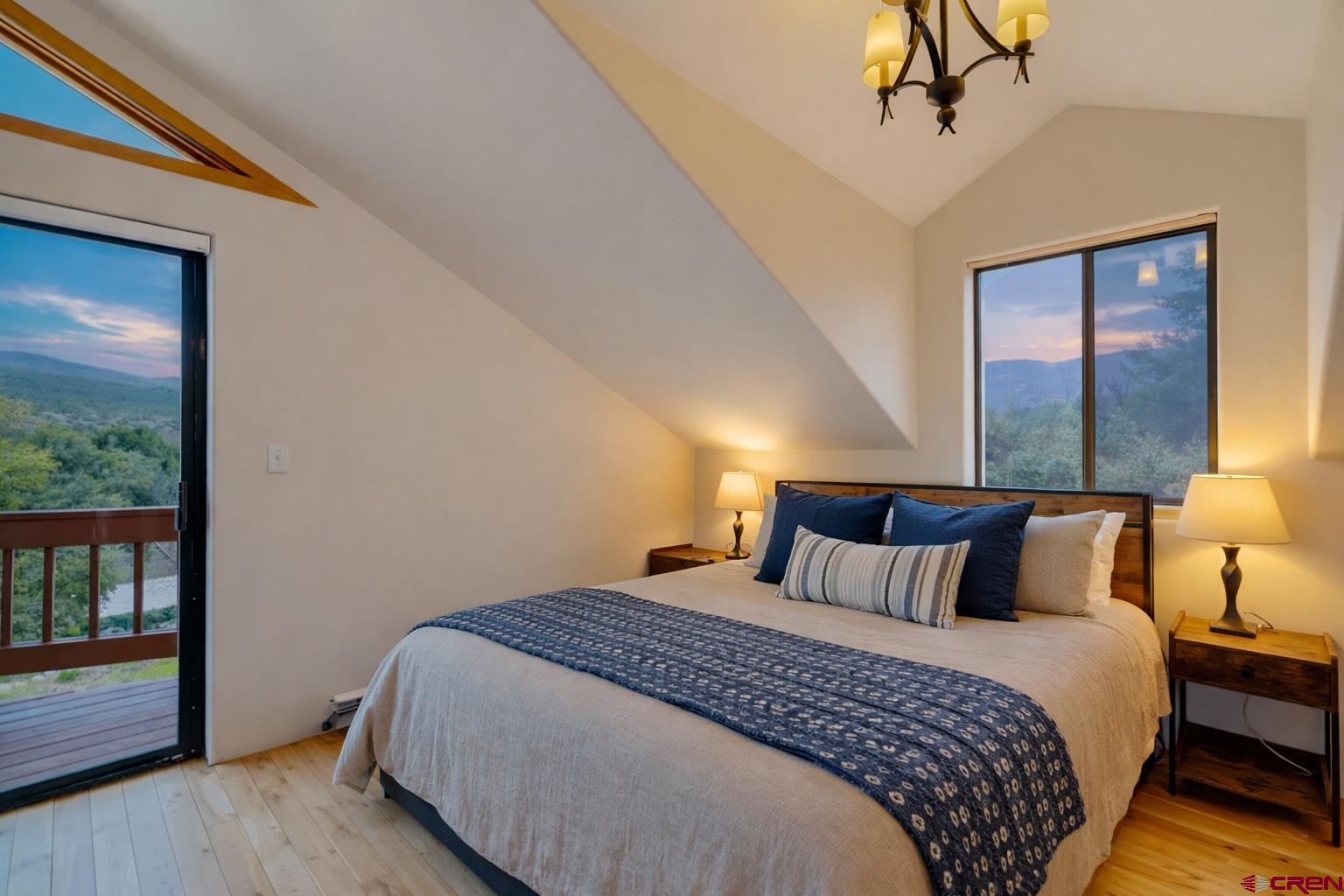 201 Ute Canyon Road Durango, CO 81301 - Photo 41 of 44 a bedroom with a bed and a window