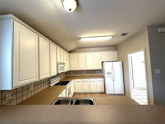 a room with a bed and a large window