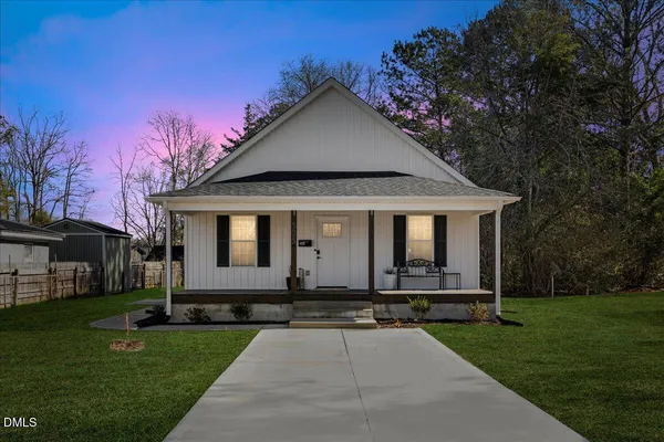 a front view of a house with yard