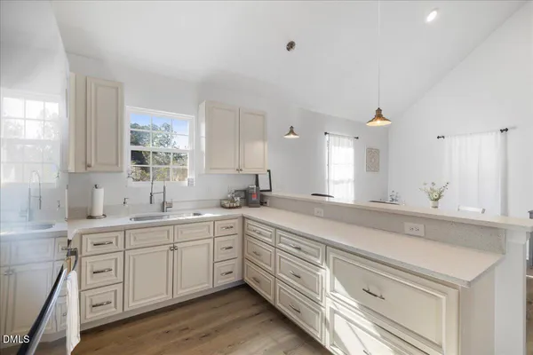 a spacious bathroom with double sink and a mirror