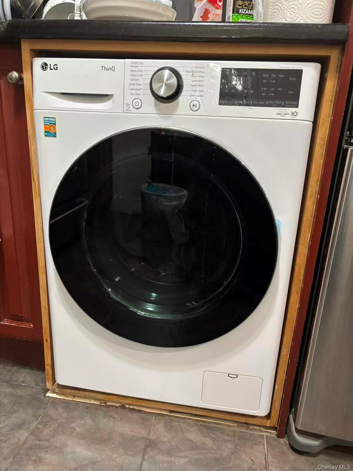 67-60 224 Street, Unit 6760A Queens, NY 11364 - Photo 6 of 12 a utility room with washer and dryer