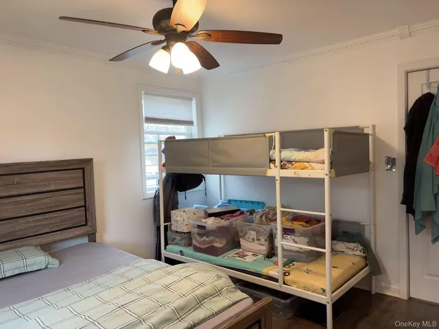 a room with a bed and a flat screen tv