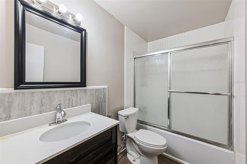 219 Bennett Street Winter Springs, FL 32708 - Photo 13 of 26 a white toilet sitting next to a bathroom sink