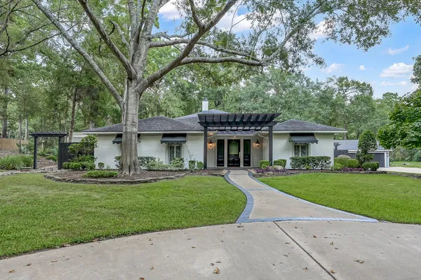 a view of a house with a yard porch and sitting area