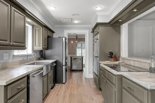 a bathroom with a sink a vanity and a large mirror