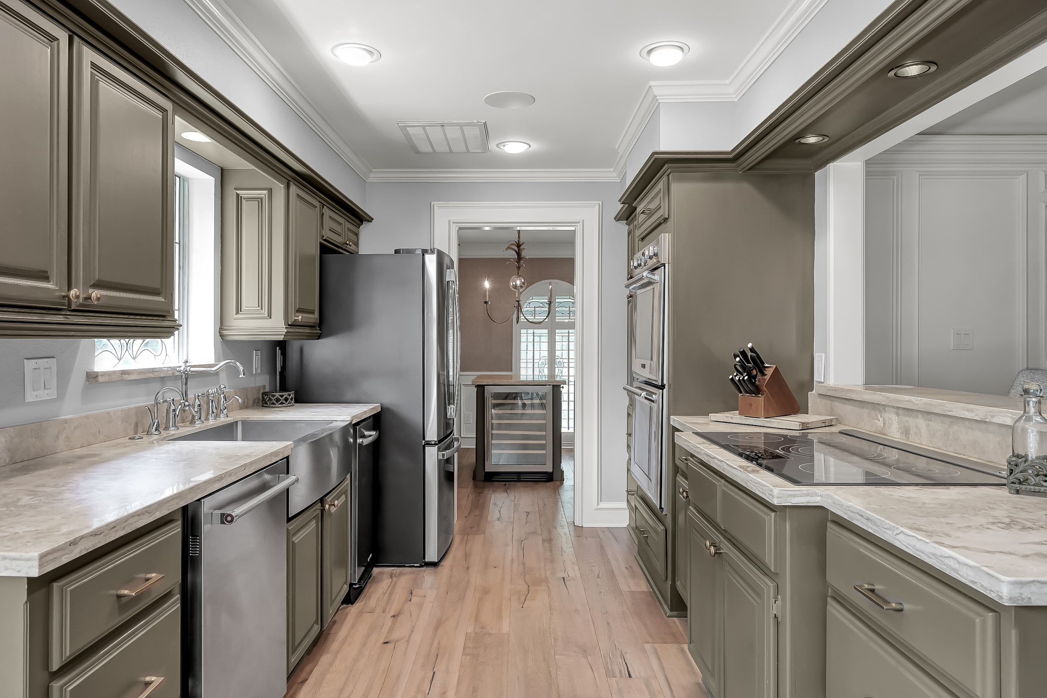 3272 Teas Nursery Road Conroe, TX 77304 - Photo 11 of 50 a kitchen with a sink stove and refrigerator