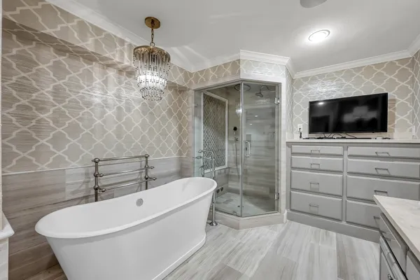 a room with a chandelier and a sink