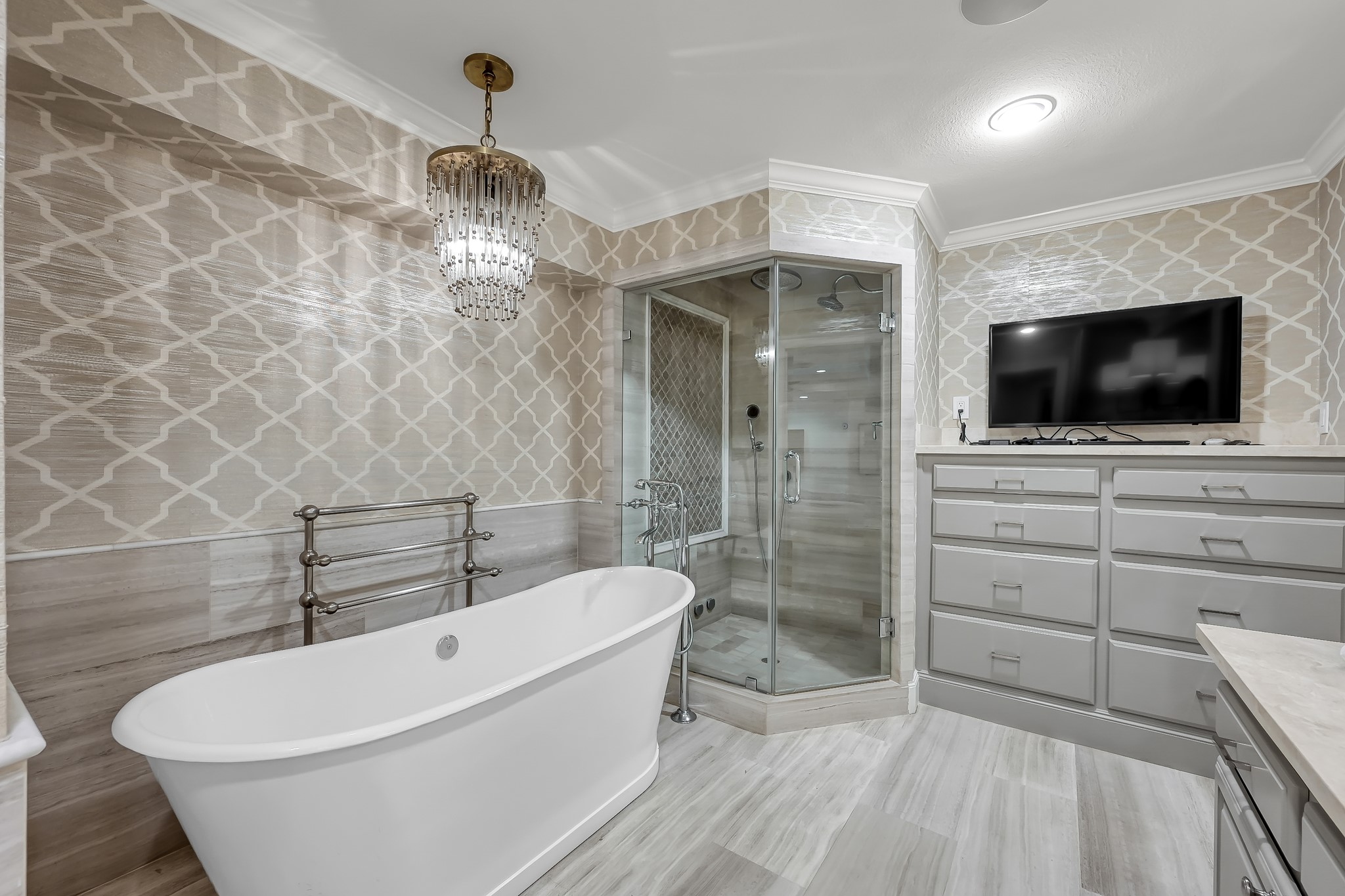 3272 Teas Nursery Road Conroe, TX 77304 - Photo 20 of 50 a bathroom with a bathtub a toilet and a flat screen tv