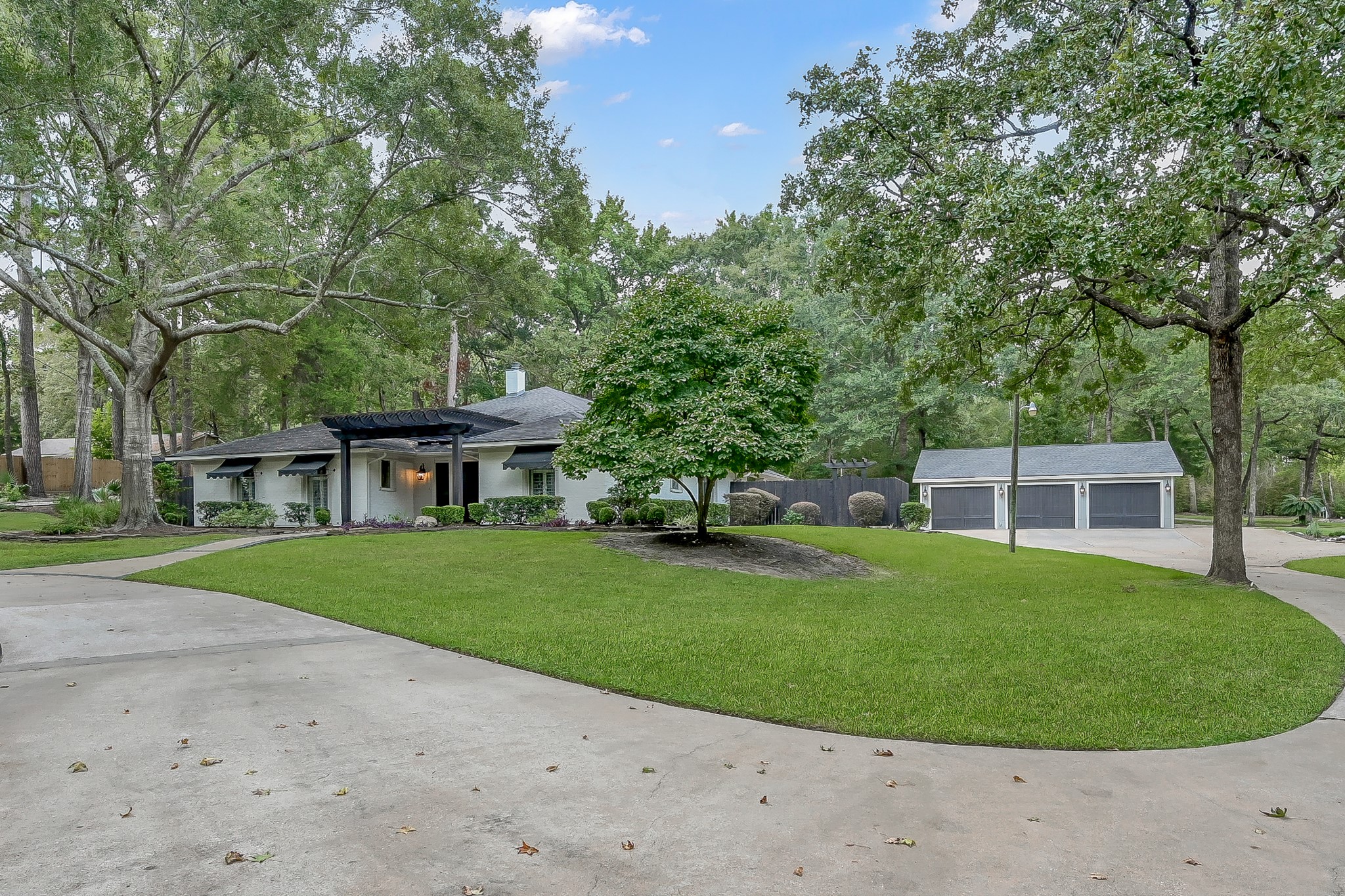 3272 Teas Nursery Road Conroe, TX 77304 - Photo 2 of 50 a view of a house with a backyard