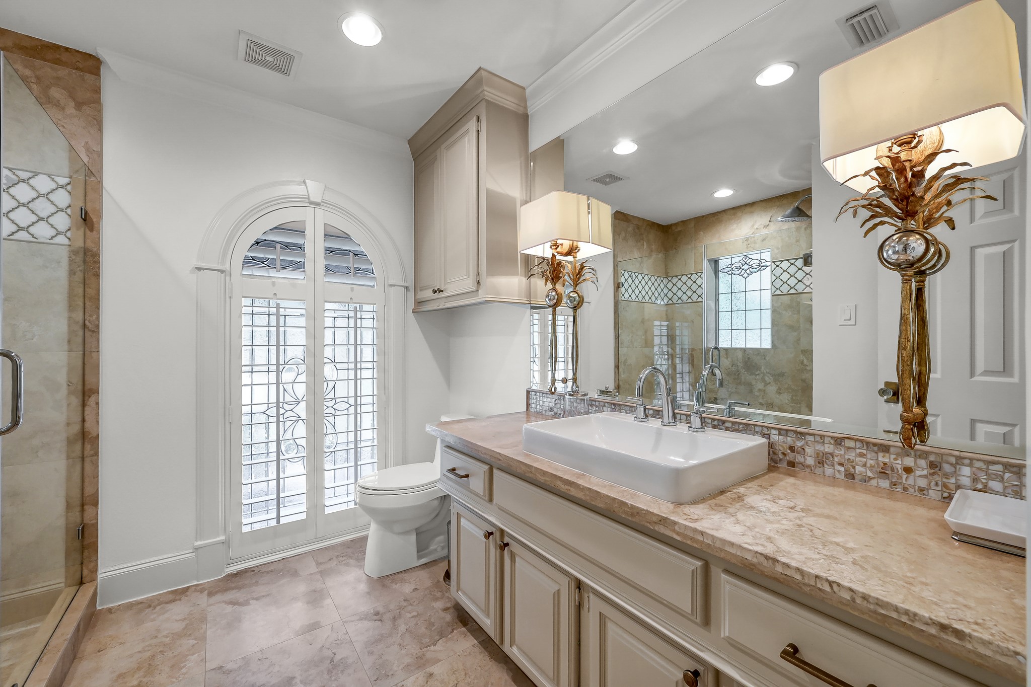 3272 Teas Nursery Road Conroe, TX 77304 - Photo 24 of 50 a bathroom with a sink a toilet and a mirror