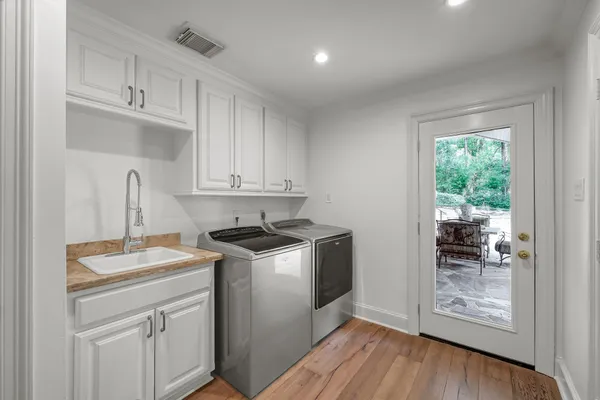 a view of a patio with a table and chairs