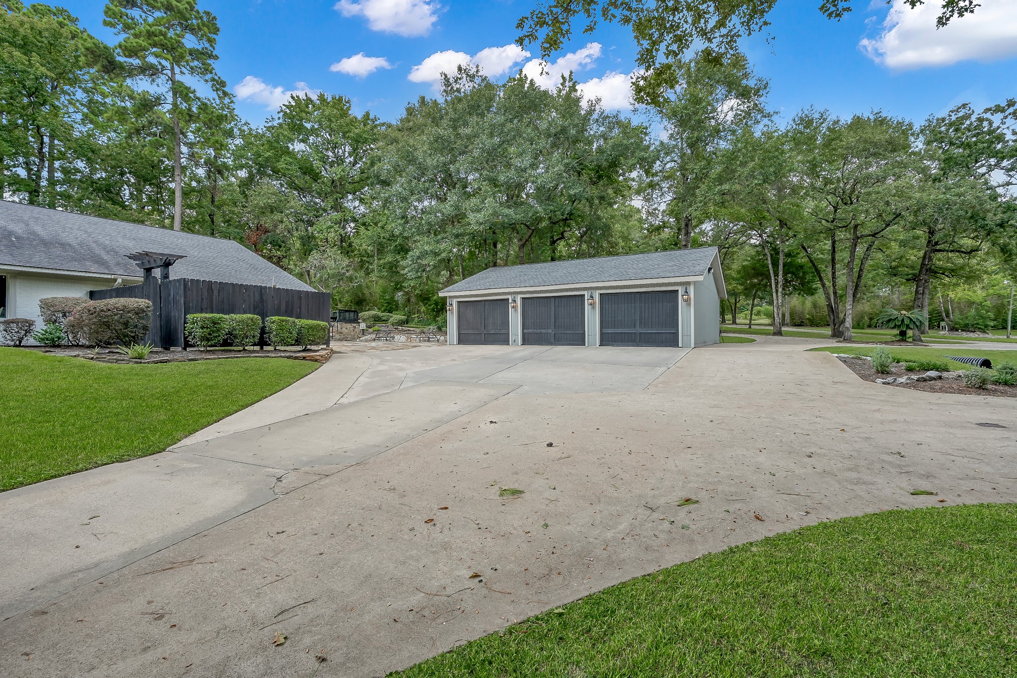 3272 Teas Nursery Road Conroe, TX 77304 - Photo 3 of 50 a view of a house with backyard and trees