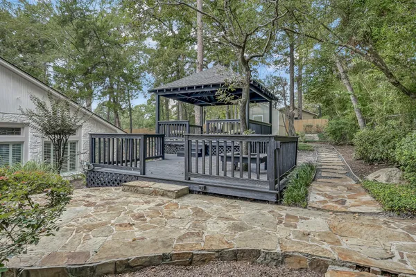 a balcony with furniture and wooden floor