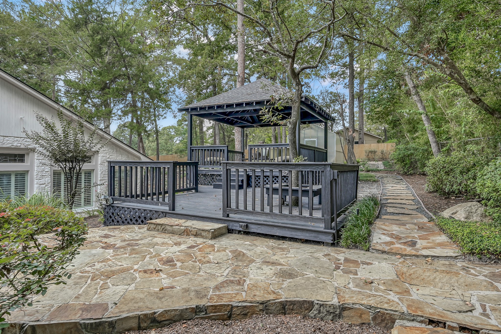 3272 Teas Nursery Road Conroe, TX 77304 - Photo 31 of 50 a view of wooden house with large trees and wooden fence