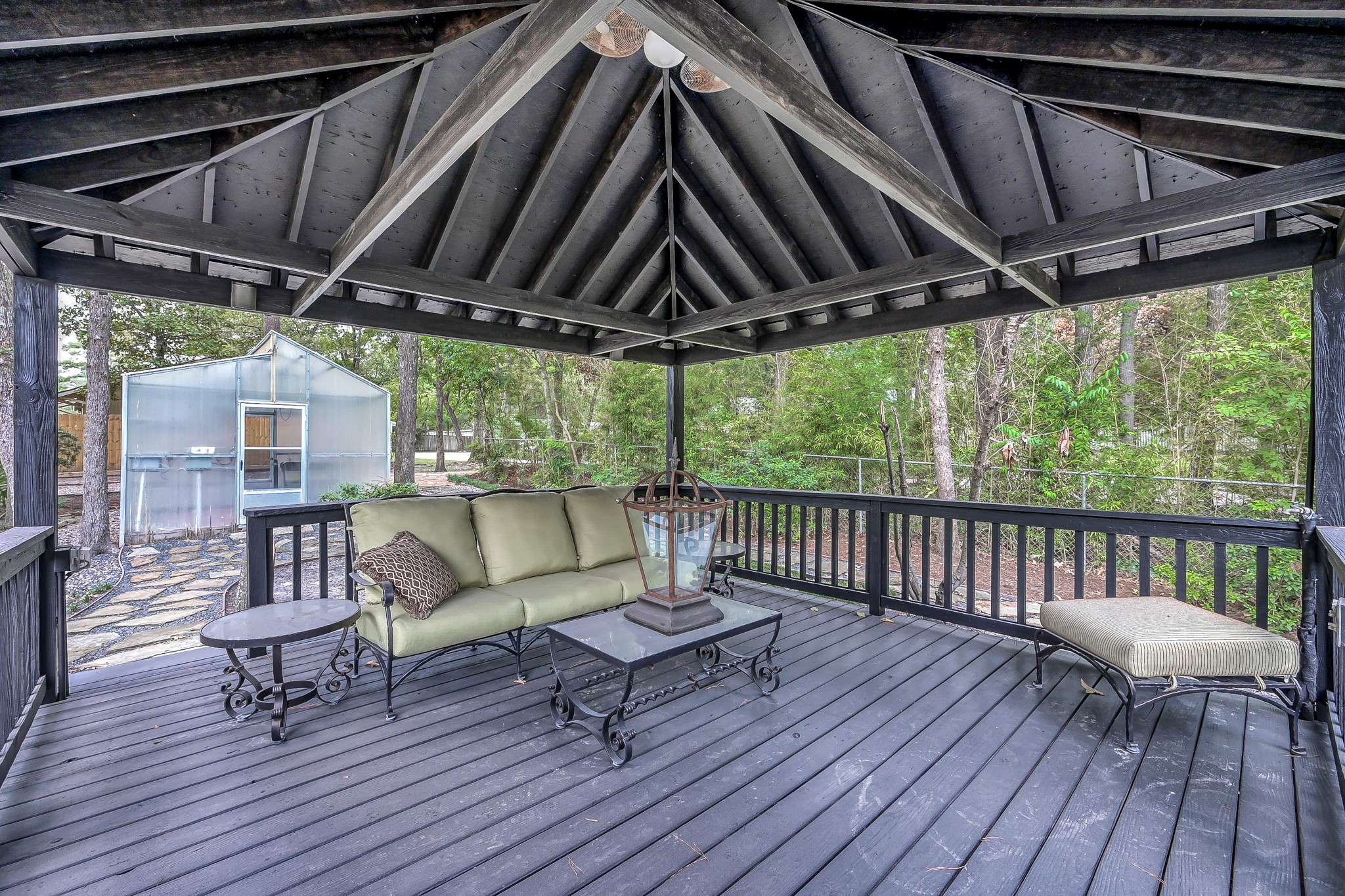 3272 Teas Nursery Road Conroe, TX 77304 - Photo 32 of 50 a balcony with furniture and wooden floor