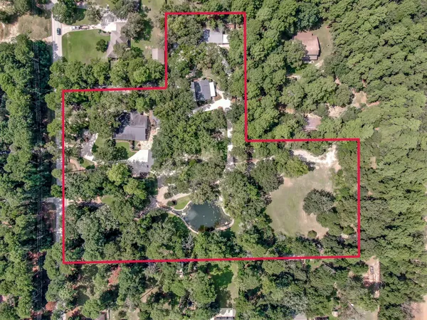 a living room with furniture a fireplace and a table