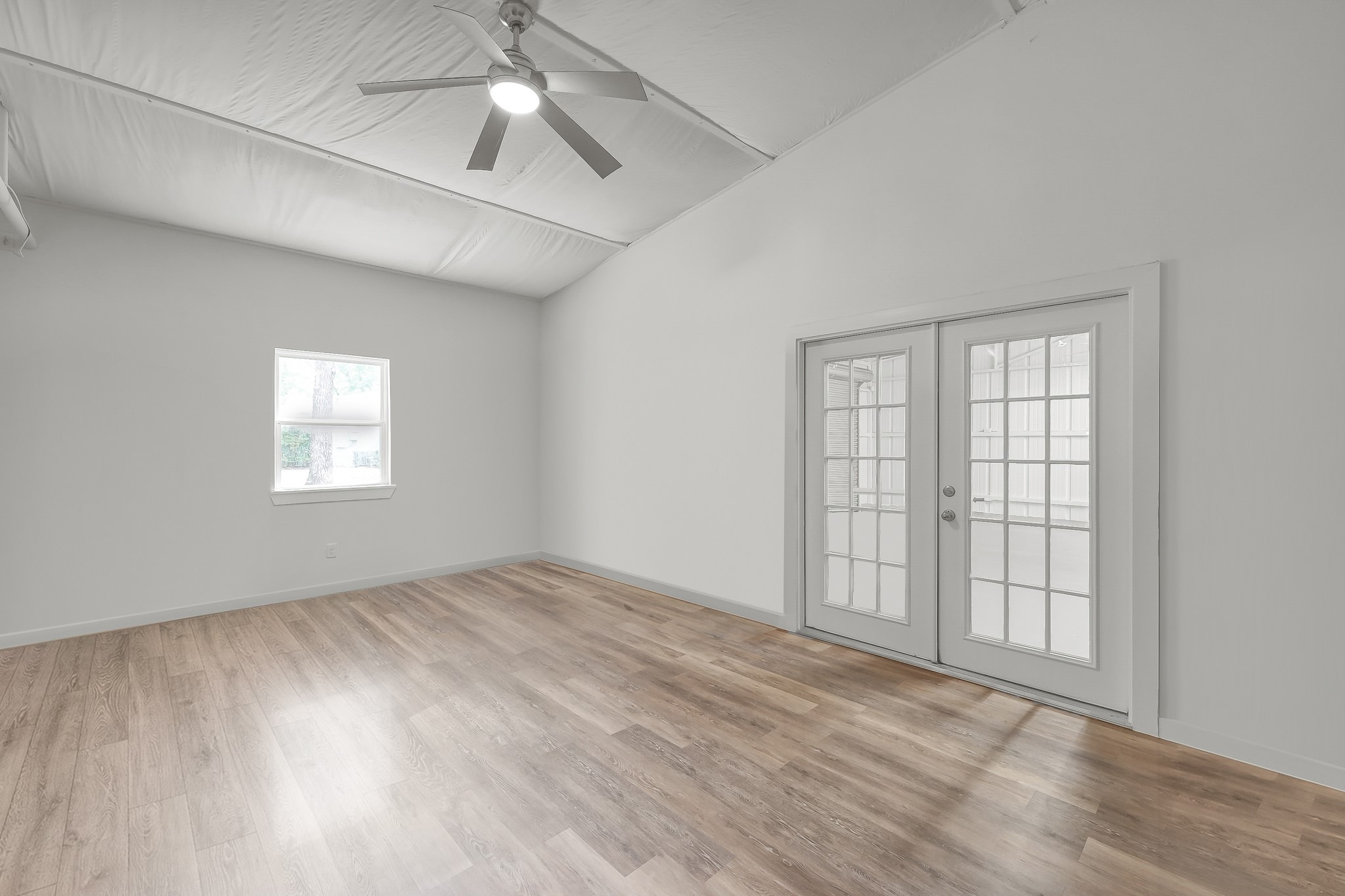 3272 Teas Nursery Road Conroe, TX 77304 - Photo 42 of 50 wooden floor in an empty room with a window