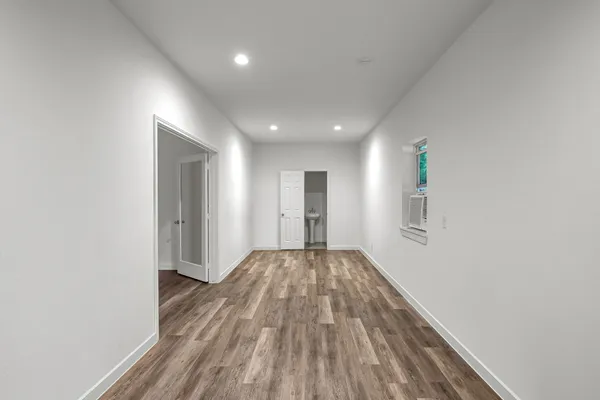 a house that has a tree in front of it