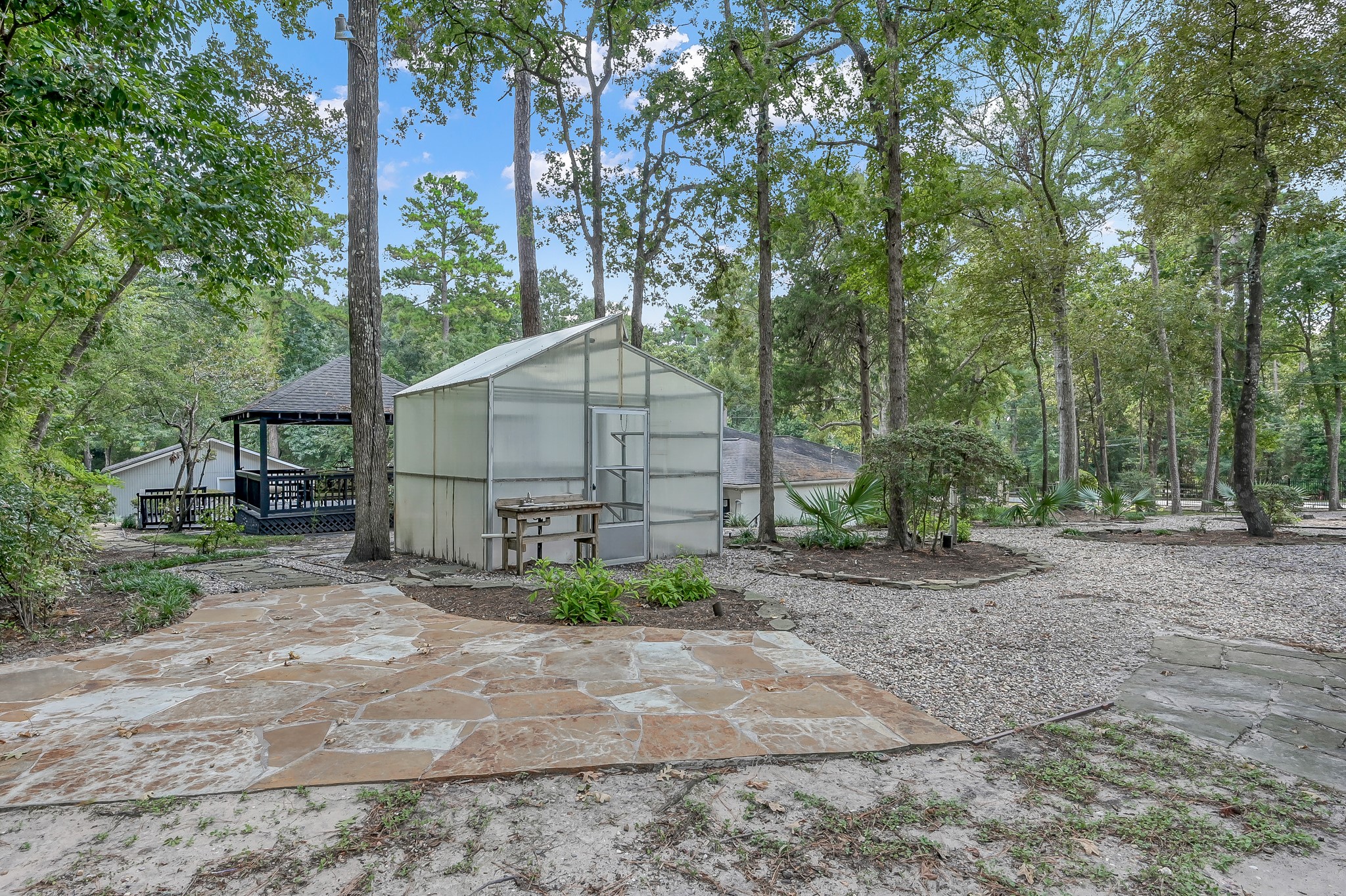 3272 Teas Nursery Road Conroe, TX 77304 - Photo 45 of 50 a house that has a tree in front of it