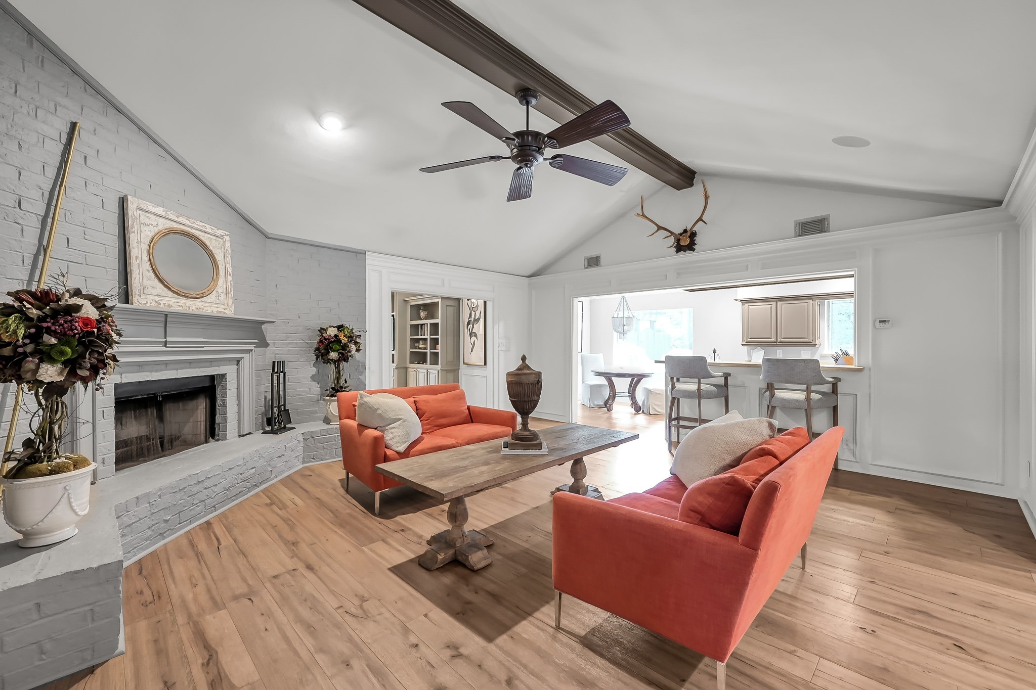 3272 Teas Nursery Road Conroe, TX 77304 - Photo 5 of 50 a living room with furniture a fireplace and a table