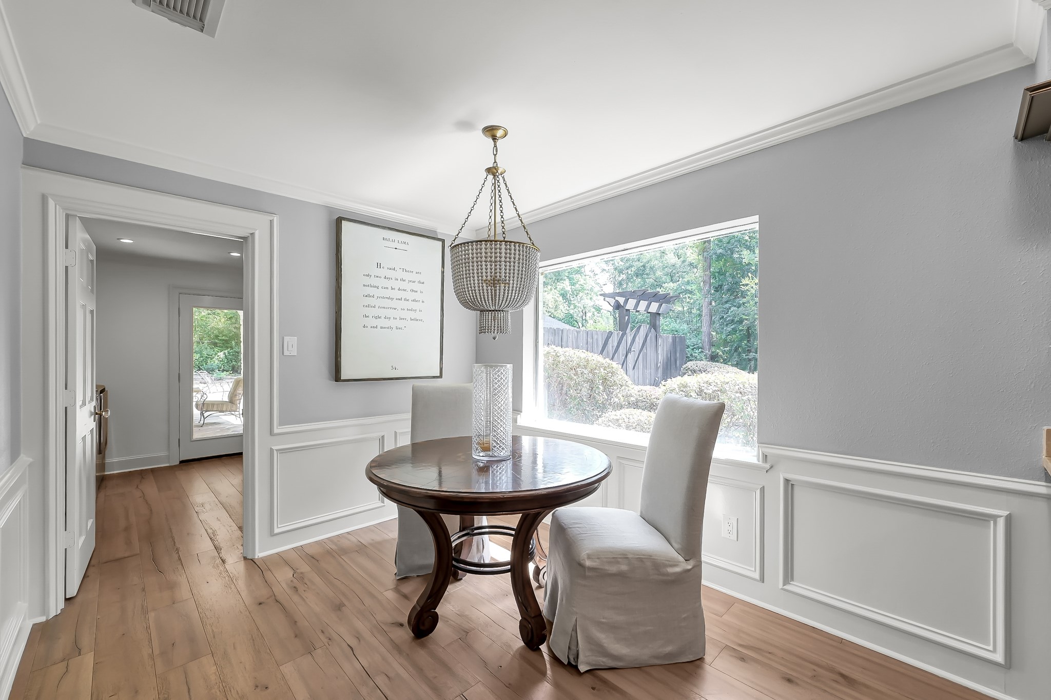 3272 Teas Nursery Road Conroe, TX 77304 - Photo 7 of 50 a dining room with furniture a chandelier and wooden floor
