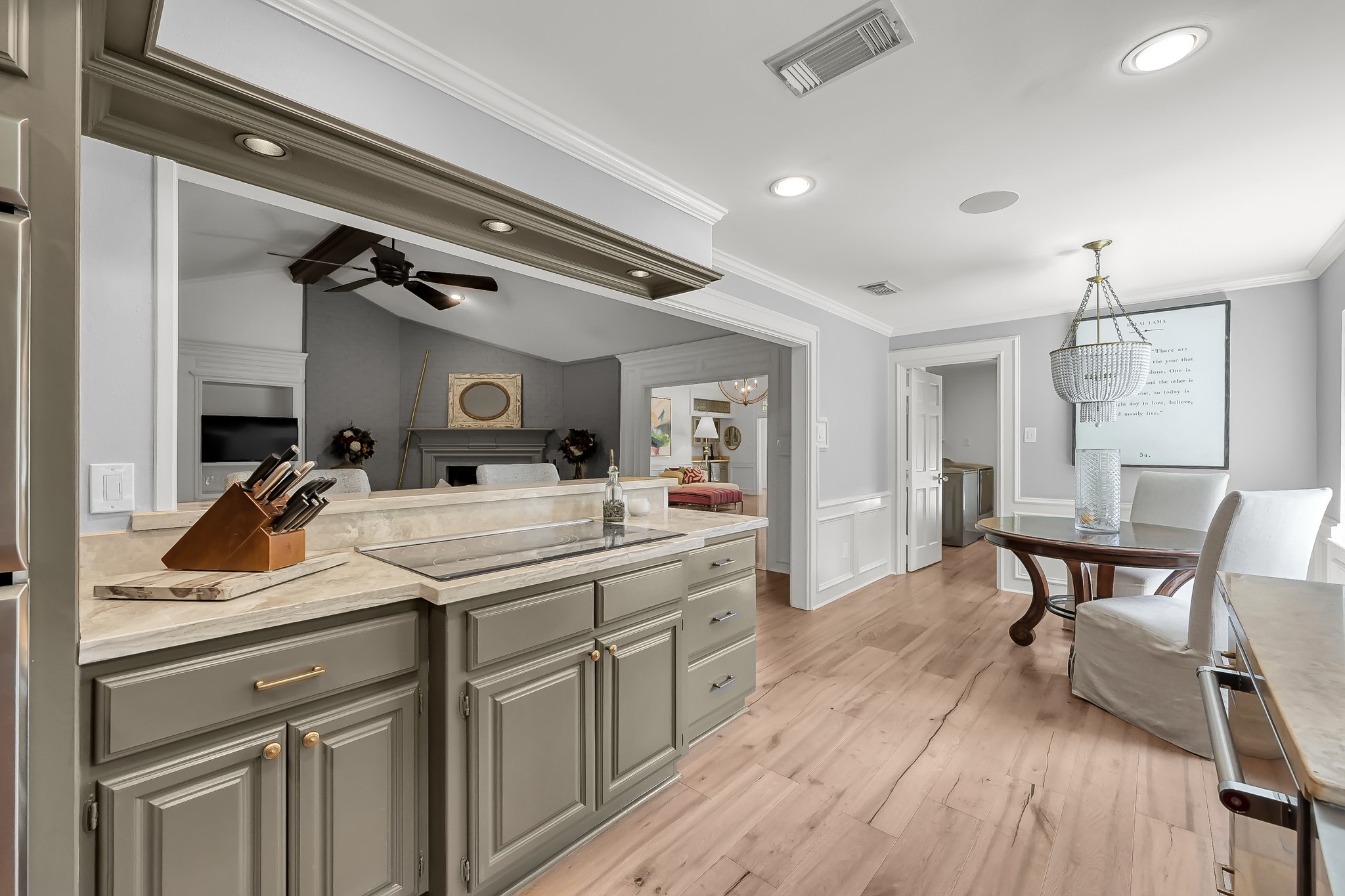 3272 Teas Nursery Road Conroe, TX 77304 - Photo 10 of 50 a view of a kitchen area with furniture and wooden floor