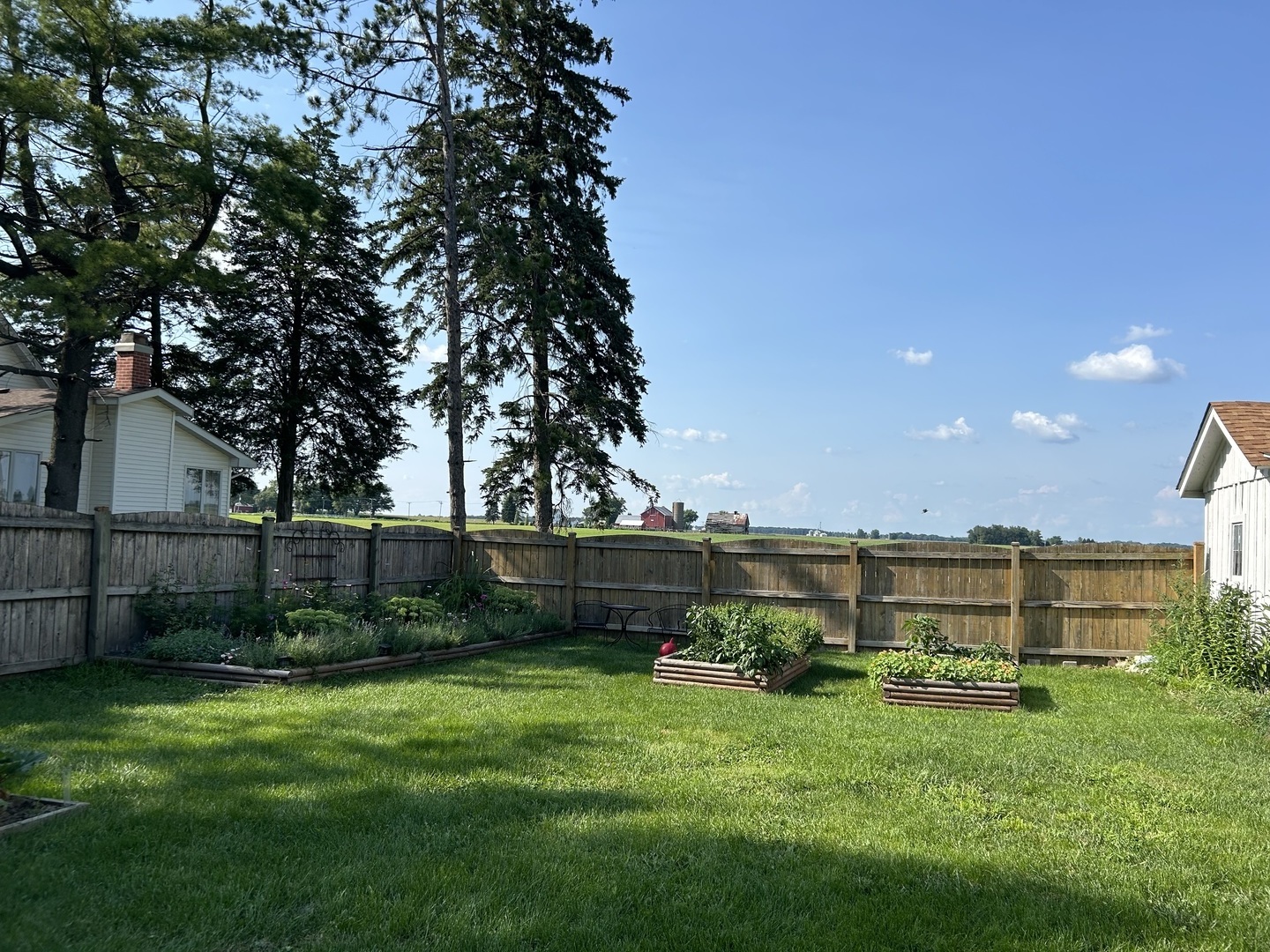 417 Virgil Street Maple Park, IL 60151 - Photo 17 of 26 a view of a backyard with a garden