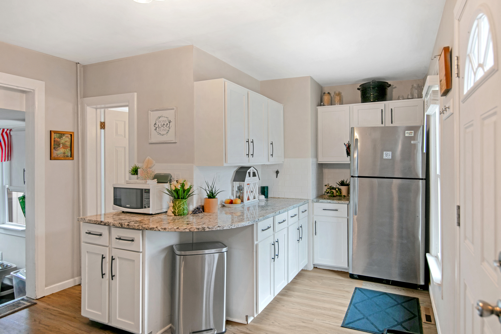 417 Virgil Street Maple Park, IL 60151 - Photo 2 of 26 a kitchen with stainless steel appliances a refrigerator sink and cabinets