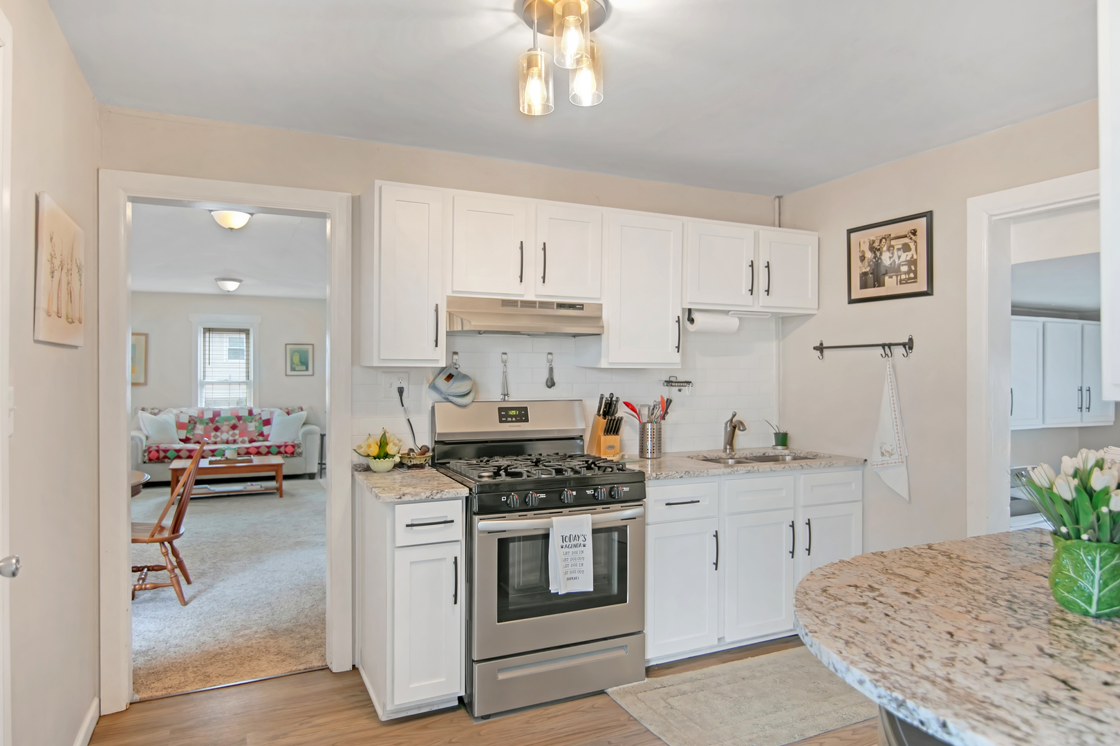 417 Virgil Street Maple Park, IL 60151 - Photo 3 of 26 a kitchen with a stove and cabinets