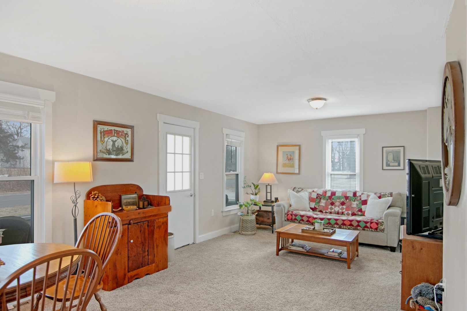 417 Virgil Street Maple Park, IL 60151 - Photo 5 of 26 a living room with furniture and a flat screen tv