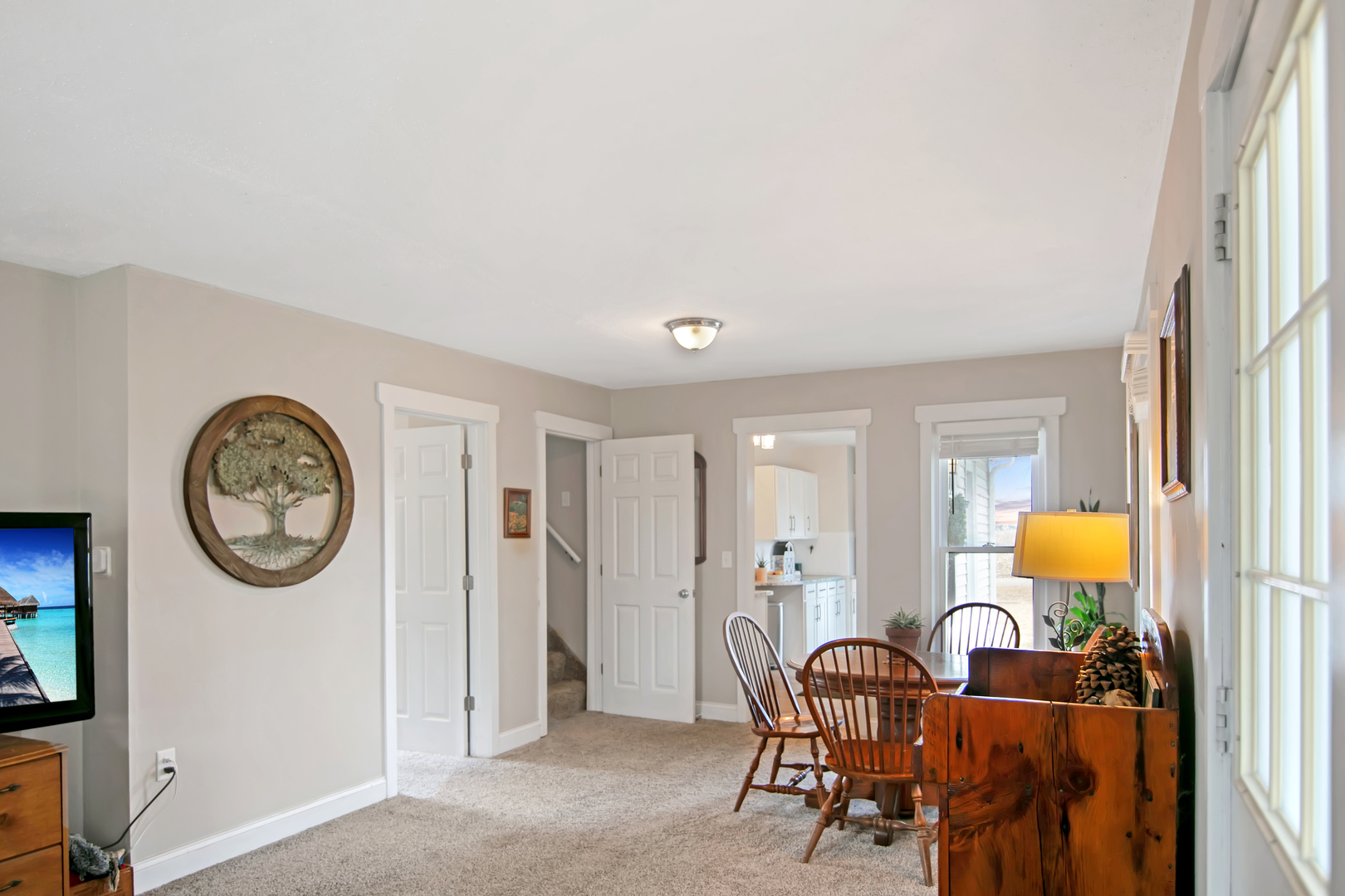 417 Virgil Street Maple Park, IL 60151 - Photo 6 of 26 a living room with furniture a clock on wall and a window