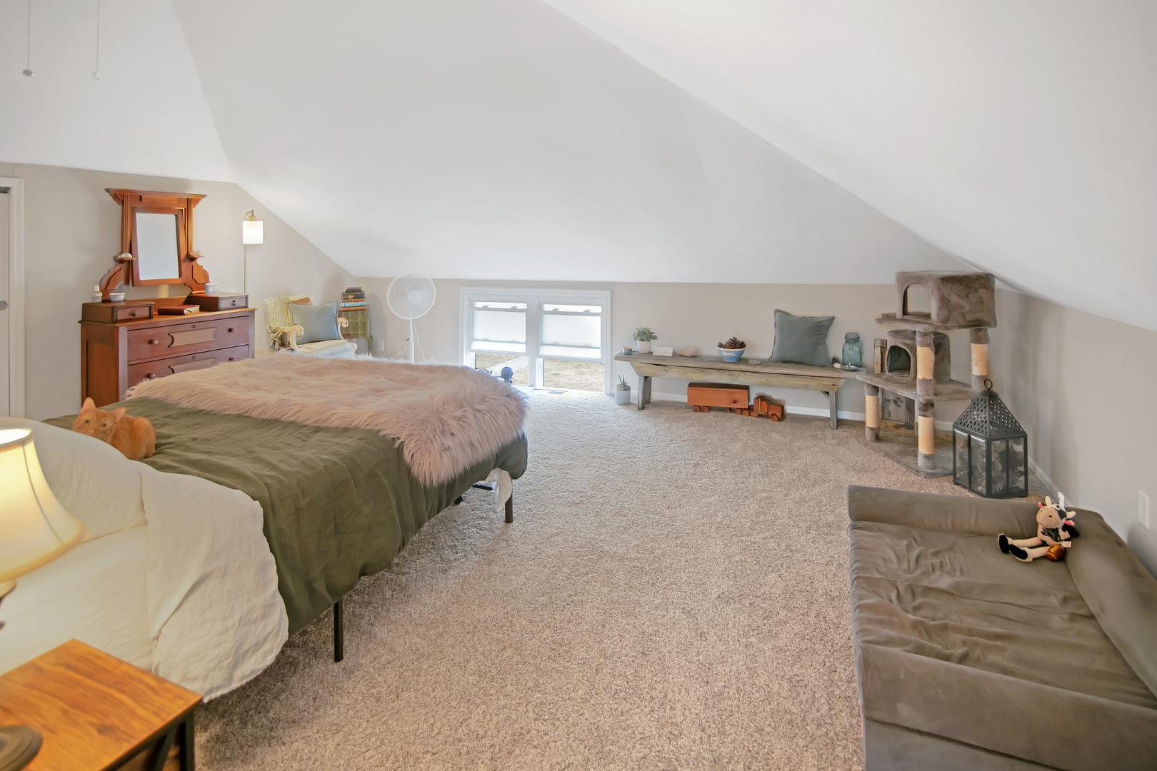 417 Virgil Street Maple Park, IL 60151 - Photo 7 of 26 a living room with a bed furniture and a flat tv screen
