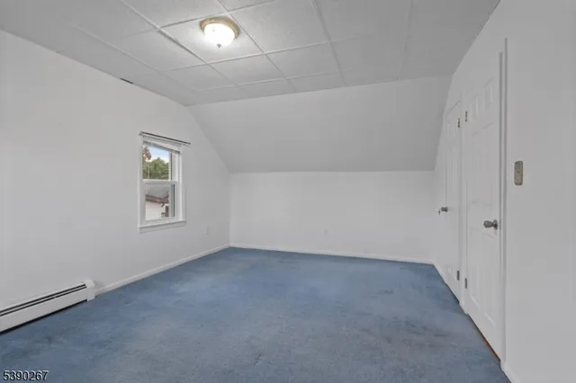 an empty room with a empty space and windows