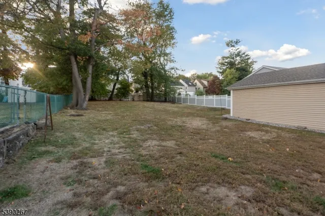 a view of a backyard of the house