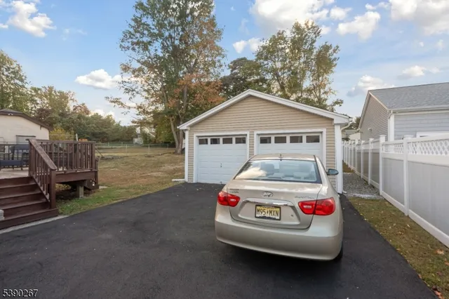 a car parked in front of a house