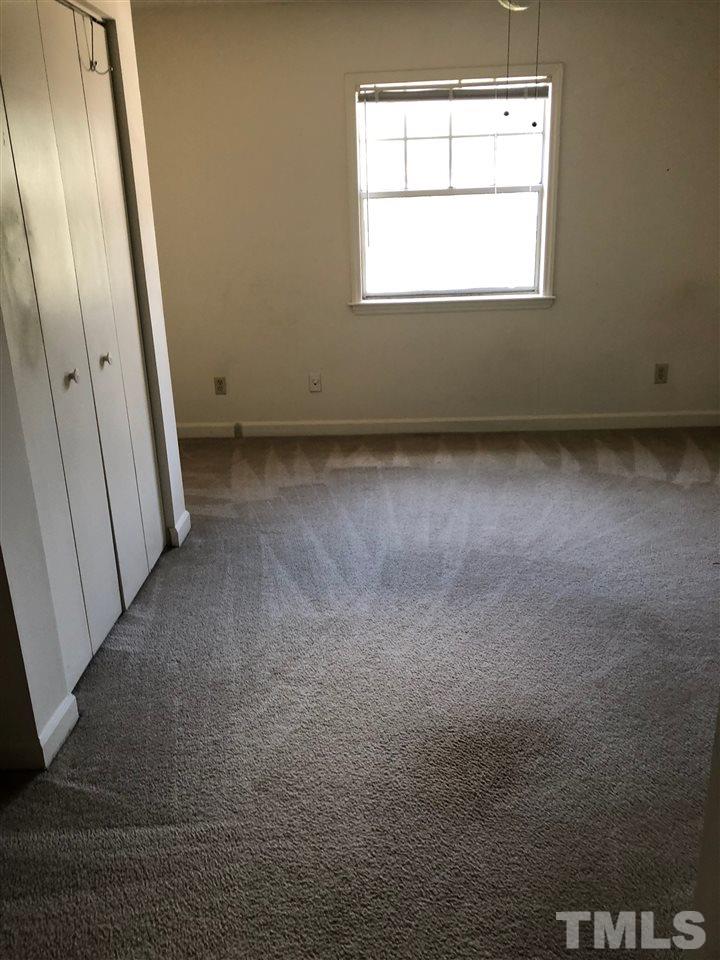 2506 Avent Ferry Road, Unit 203 Raleigh, NC 27606 - Photo 12 of 13 an empty room with a window