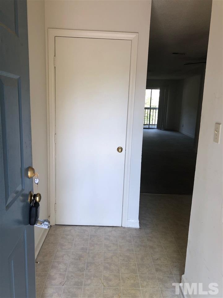 2506 Avent Ferry Road, Unit 203 Raleigh, NC 27606 - Photo 3 of 13 a view of an empty room with a window
