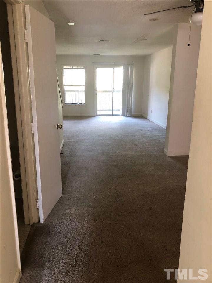 2506 Avent Ferry Road, Unit 203 Raleigh, NC 27606 - Photo 4 of 13 an empty room with windows