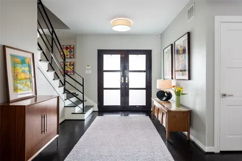 a view of entryway with stairs and wooden floor